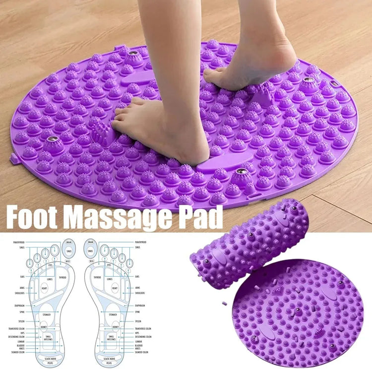 Purple foot massage pad with feet on a wooden floor, showing detailed diagram of foot pressure points.
